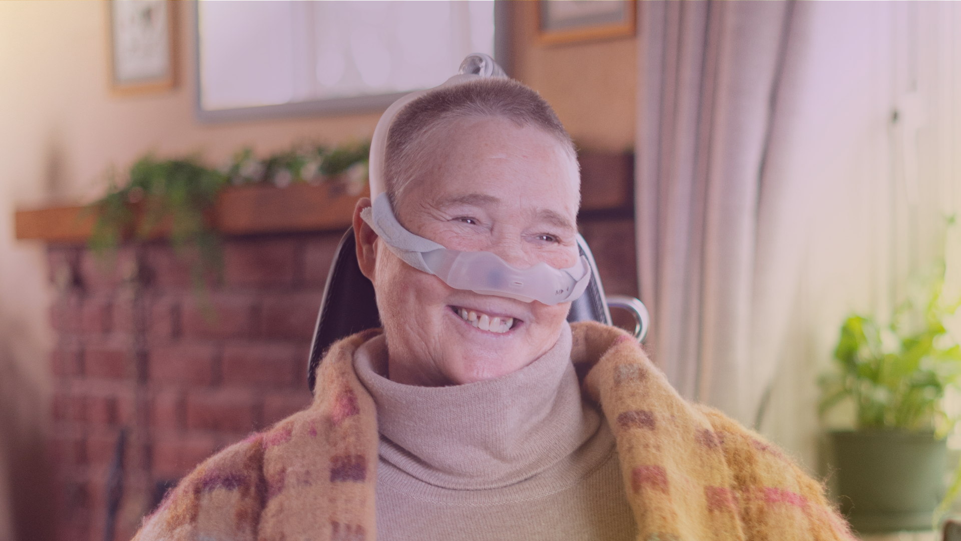 Happy client smiling after receiving care from Komplex Care