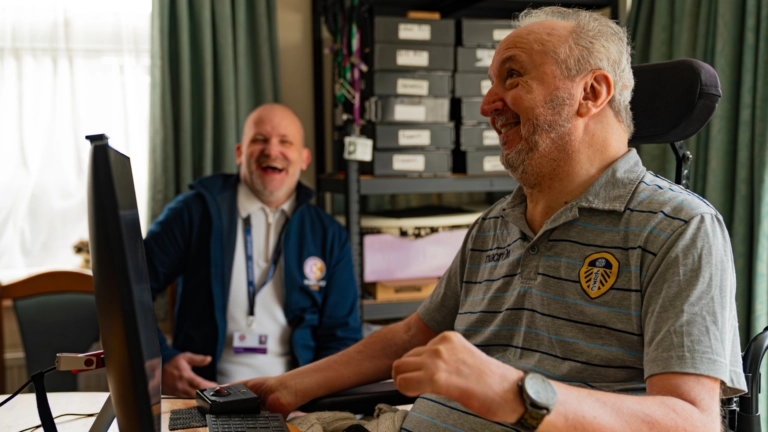 Client sharing a positive moment with Komplex Care Operations Manager