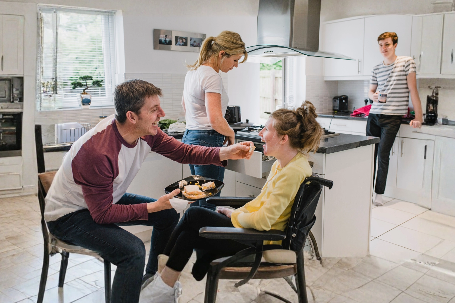 Family receiving support and reassurance through personalised complex care at home services from Komplex Care