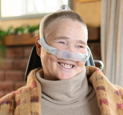 Marion smiling and showing the positive impact of her nurse-led complex care package at home provided by Komplex Care