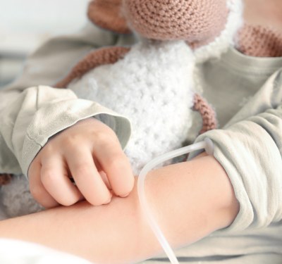 Healthcare professionals providing paediatric complex care to a young child